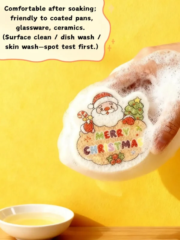 Santa Claus cellulose sponge foaming up with soap on a yellow background, held in hand while washing.