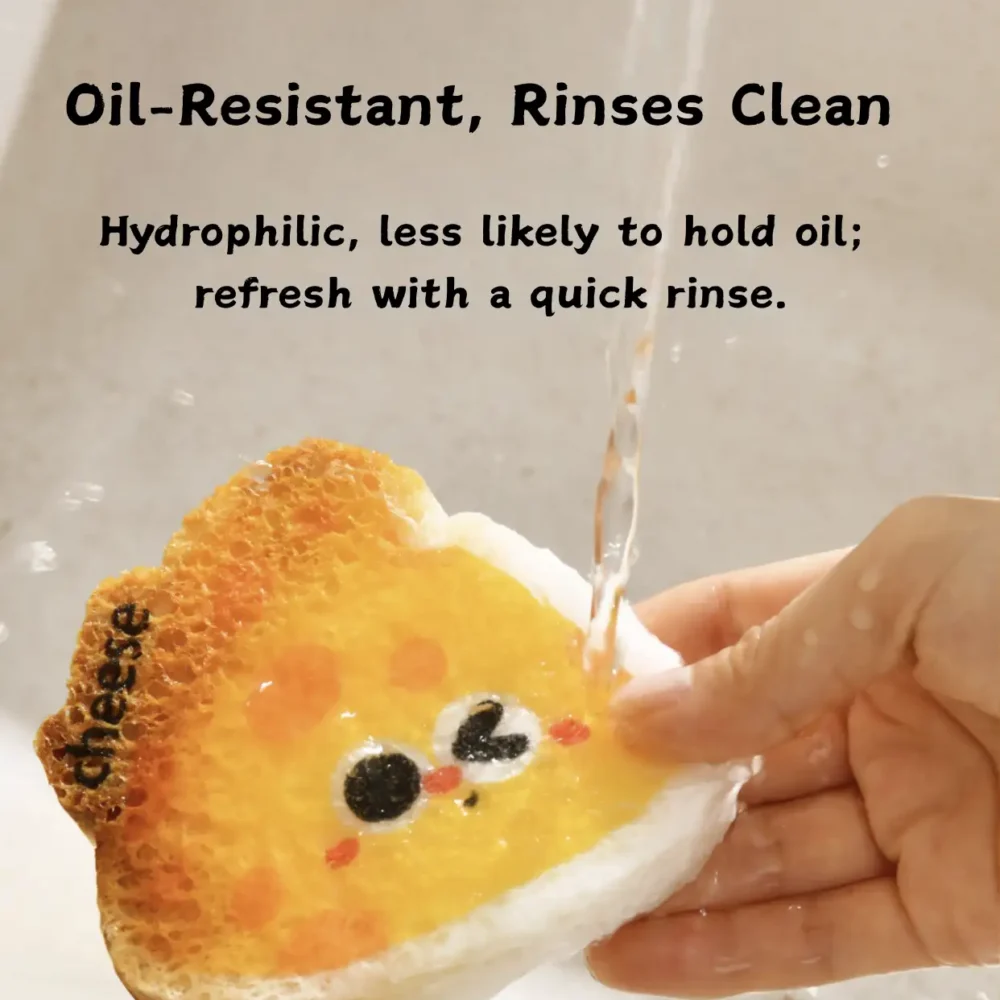 Cheese-shaped cellulose sponge rinsing clean under running water