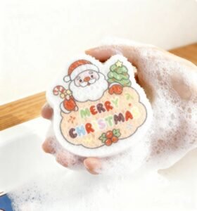 Hand squeezing foamy Doyourclean Santa sponge and hanging it to dry